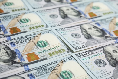 Photo of Many dollar banknotes as background, closeup view