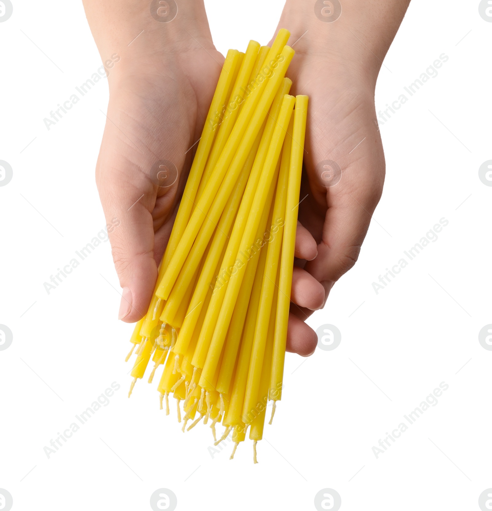 Photo of Woman holding church candles on white background, top view