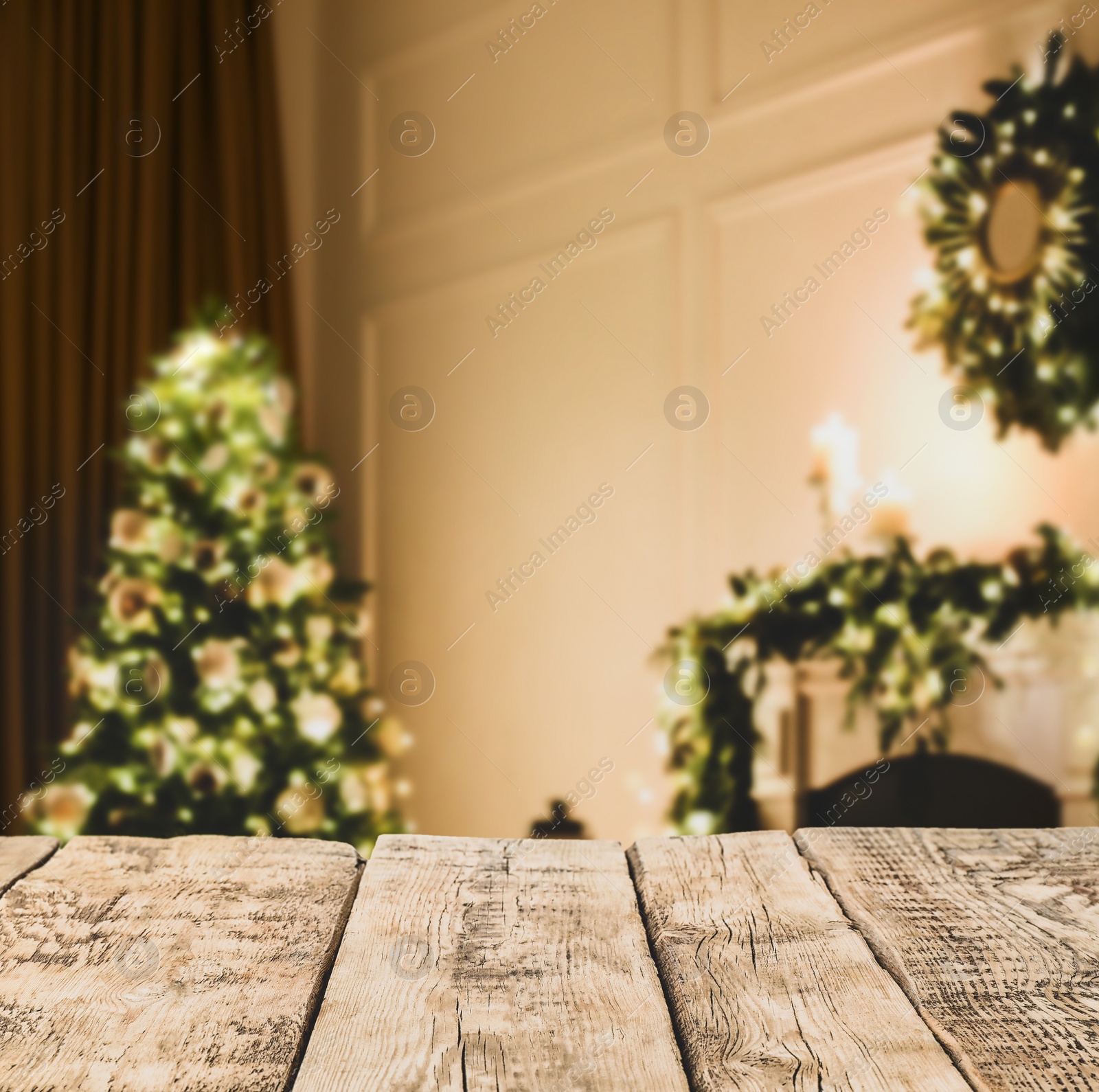 Image of Empty wooden surface and blurred view of Christmas tree in room, space for text. Interior design