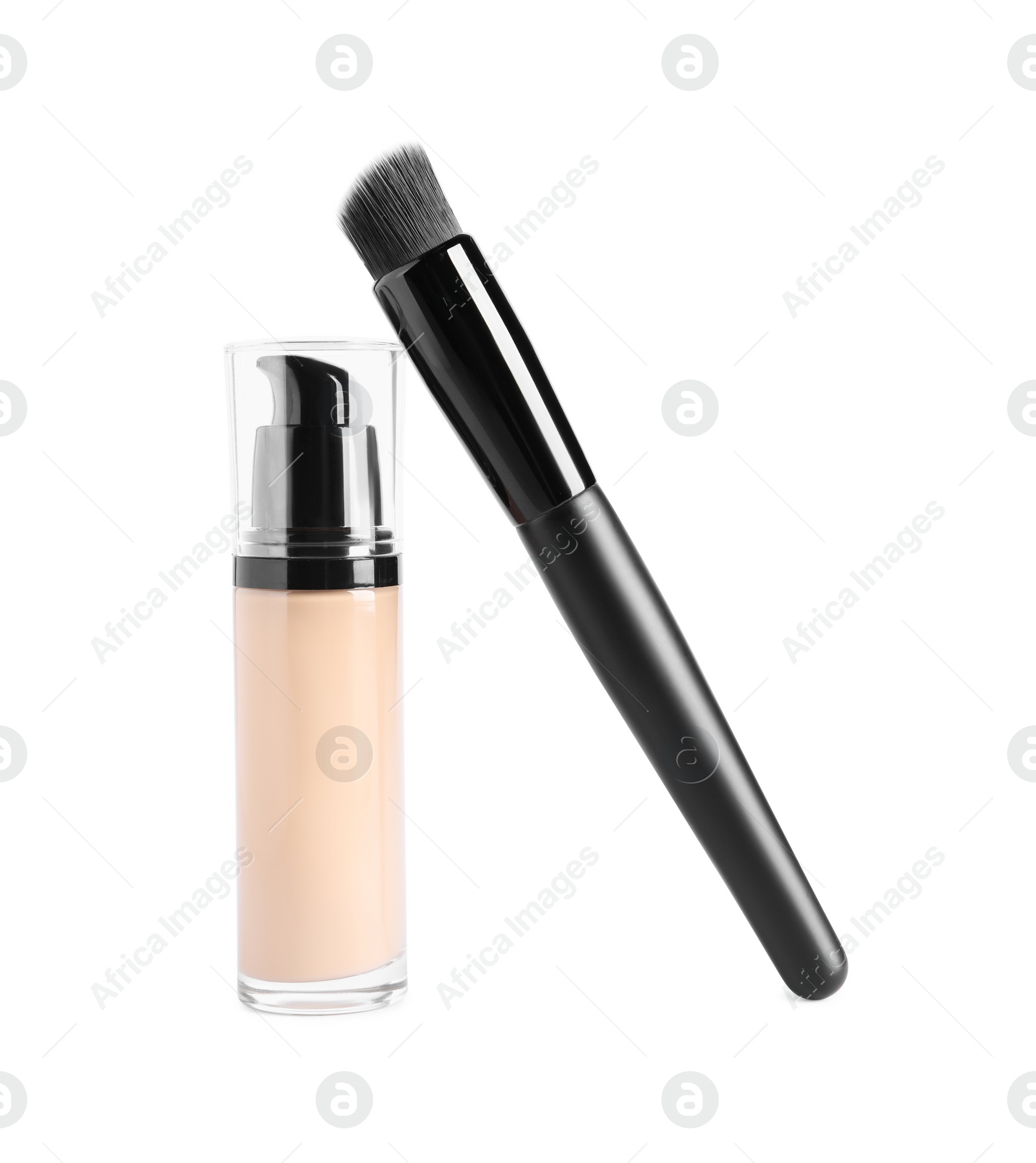 Photo of Bottle of skin foundation and brush on white background. Makeup product