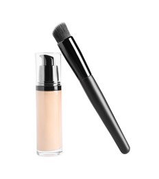 Bottle of skin foundation and brush on white background. Makeup product