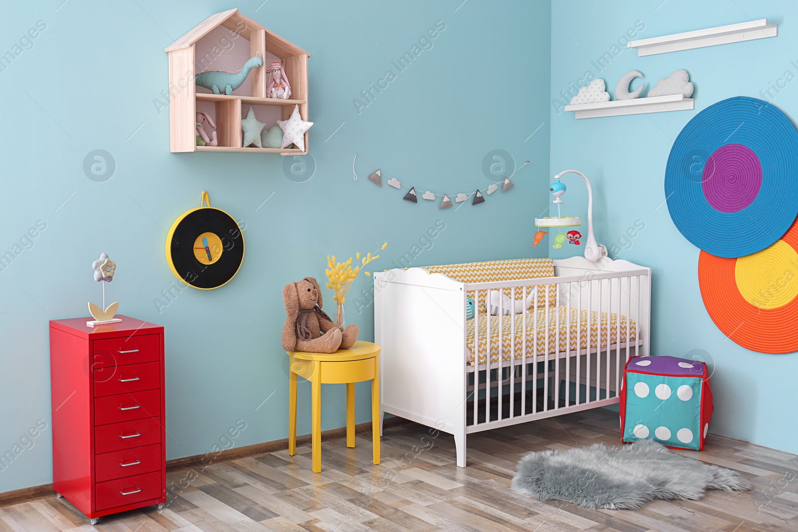 Photo of Interior of baby room with comfortable crib