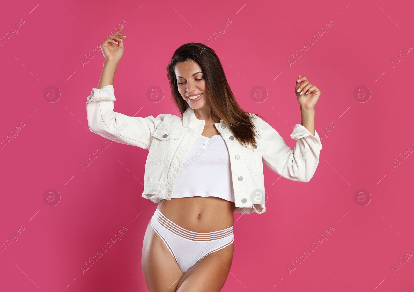 Photo of Beautiful woman in white panties on pink background