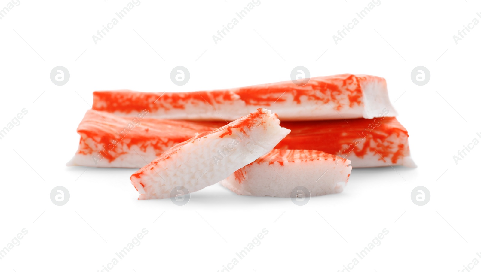 Photo of Cut and whole crab sticks isolated on white