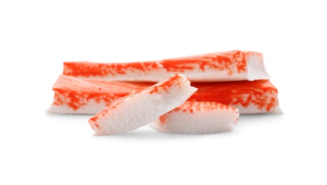 Photo of Cut and whole crab sticks isolated on white