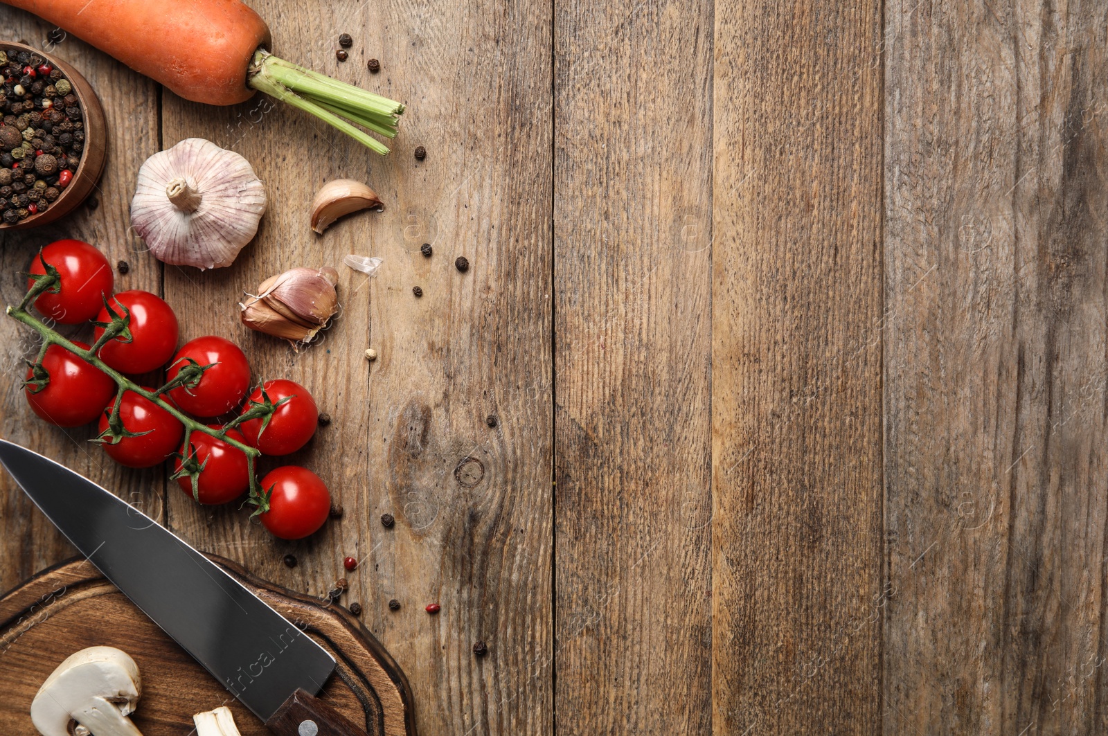 Photo of Flat lay composition with ingredients for cooking on wooden table. Space for text