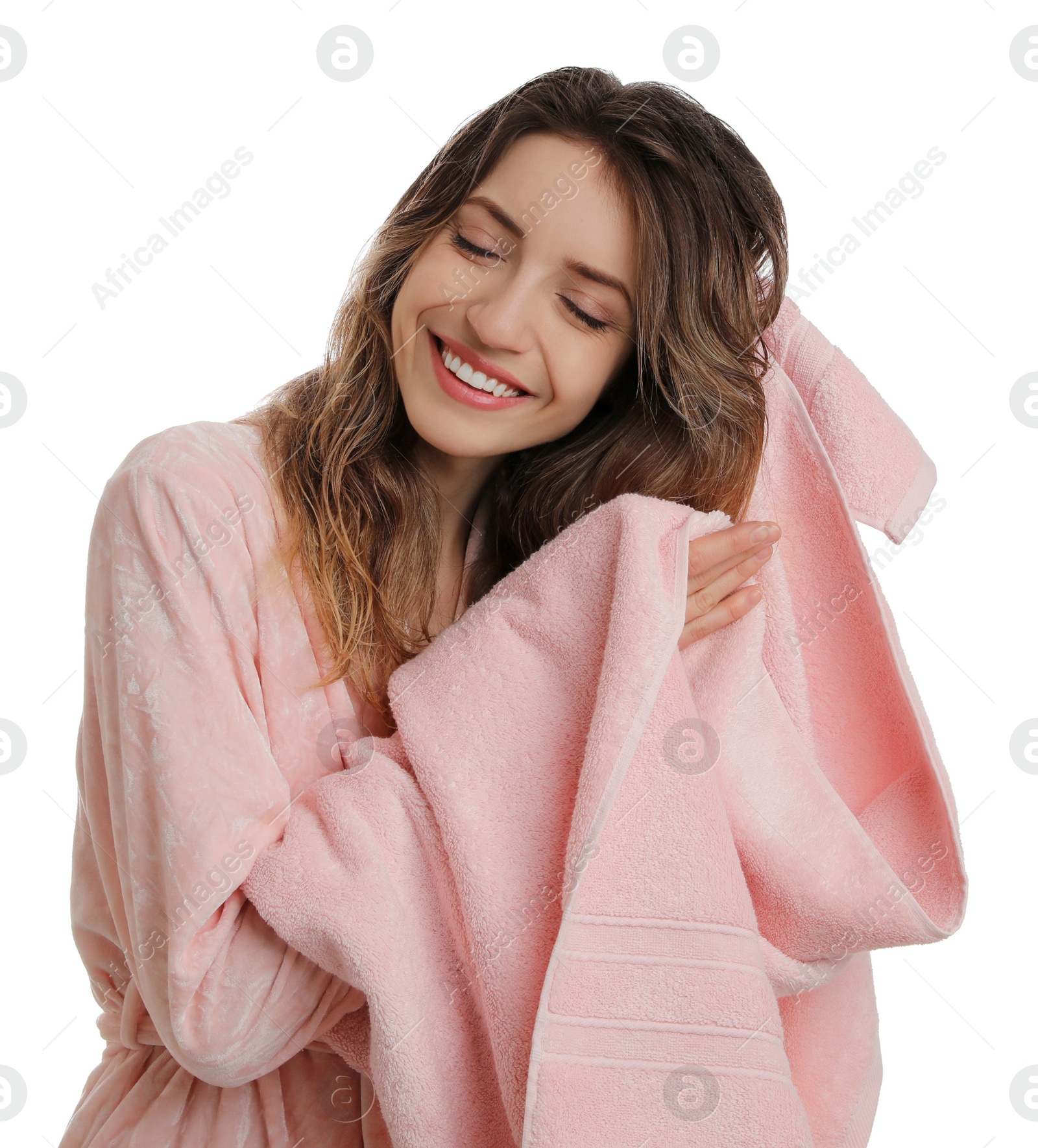 Photo of Beautiful young woman wiping hair with towel after washing on white background