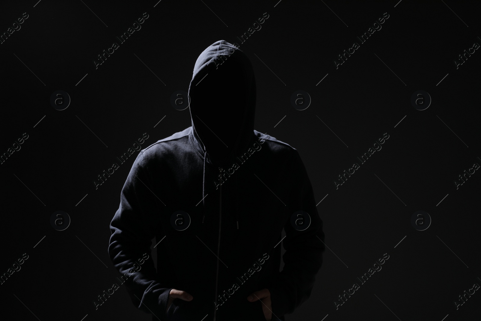 Photo of Silhouette of anonymous man on black background