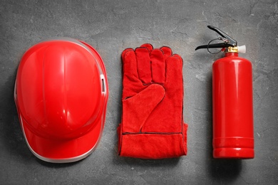 Photo of Flat lay composition with safety equipment on grey background
