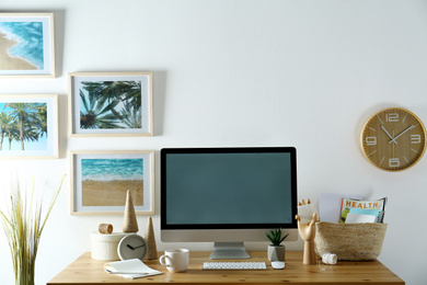 Photo of Modern computer and office supplies on wooden table, space for text. Designer's workplace