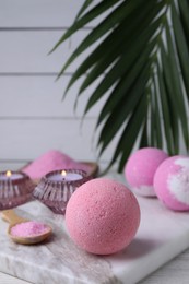 Beautiful composition with aromatic bath bombs on table