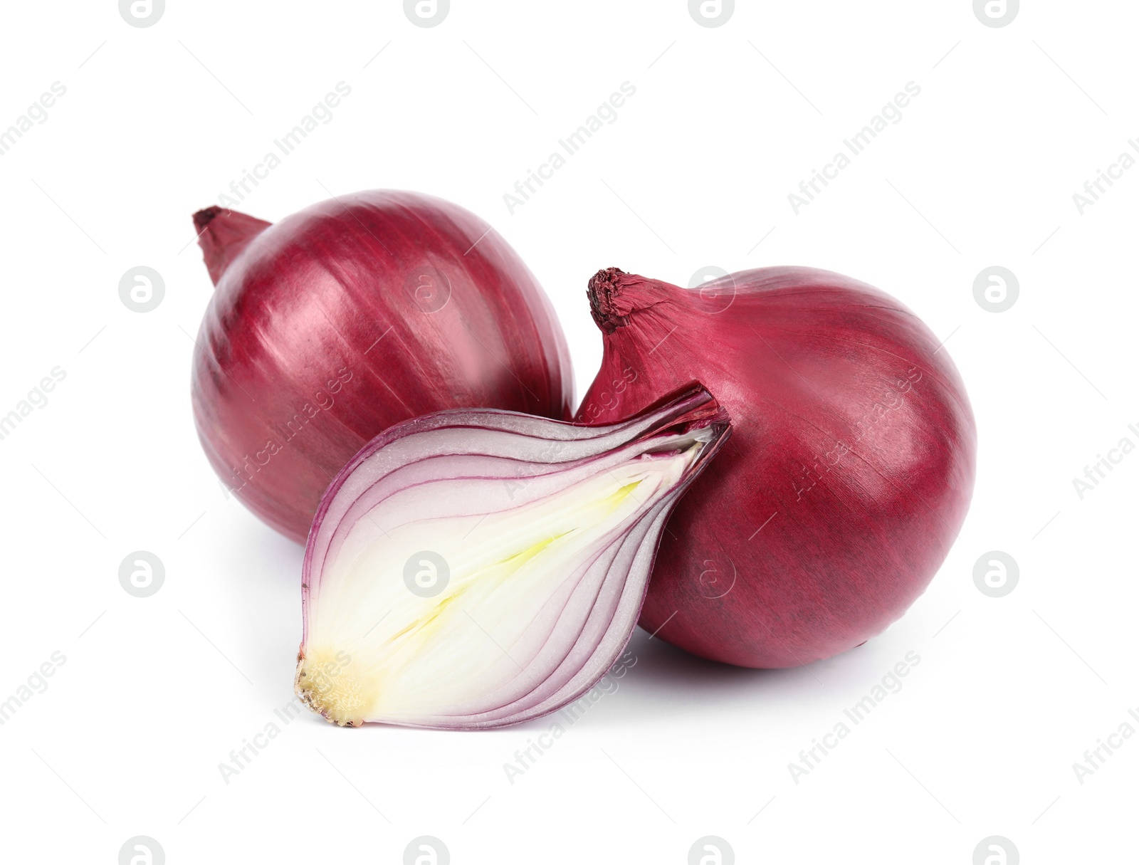 Photo of Fresh whole and cut red onions on white background