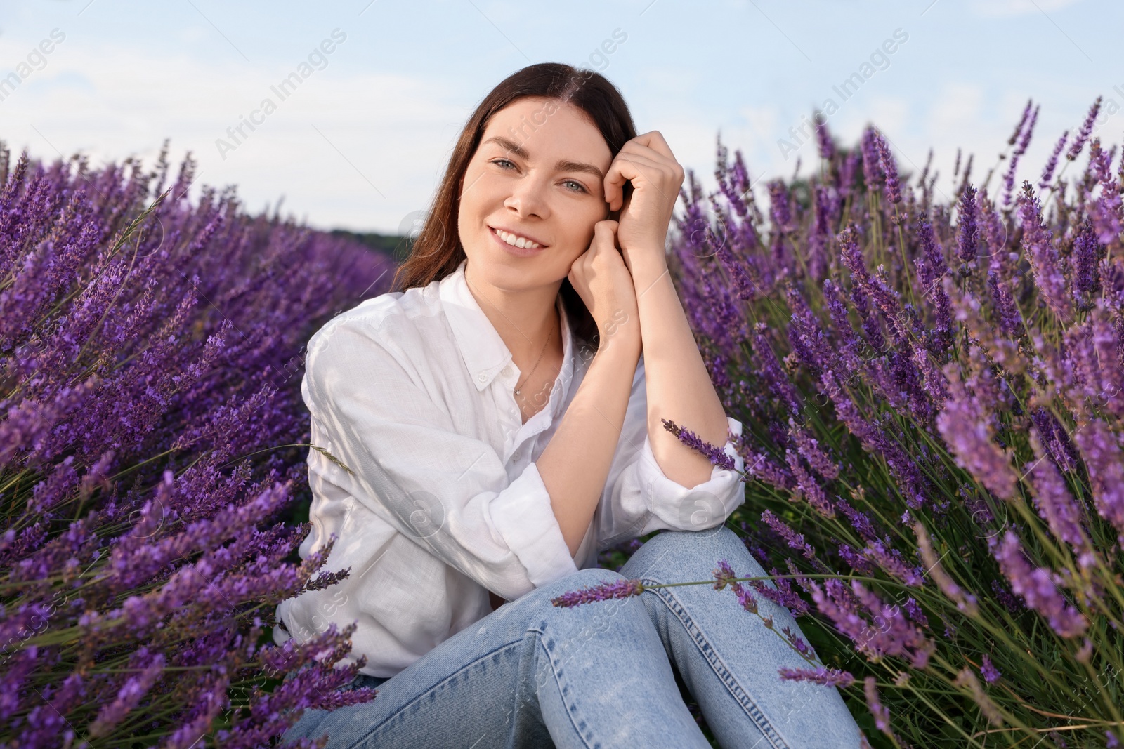 Photo of Portrait of beautiful young woman in lavender field