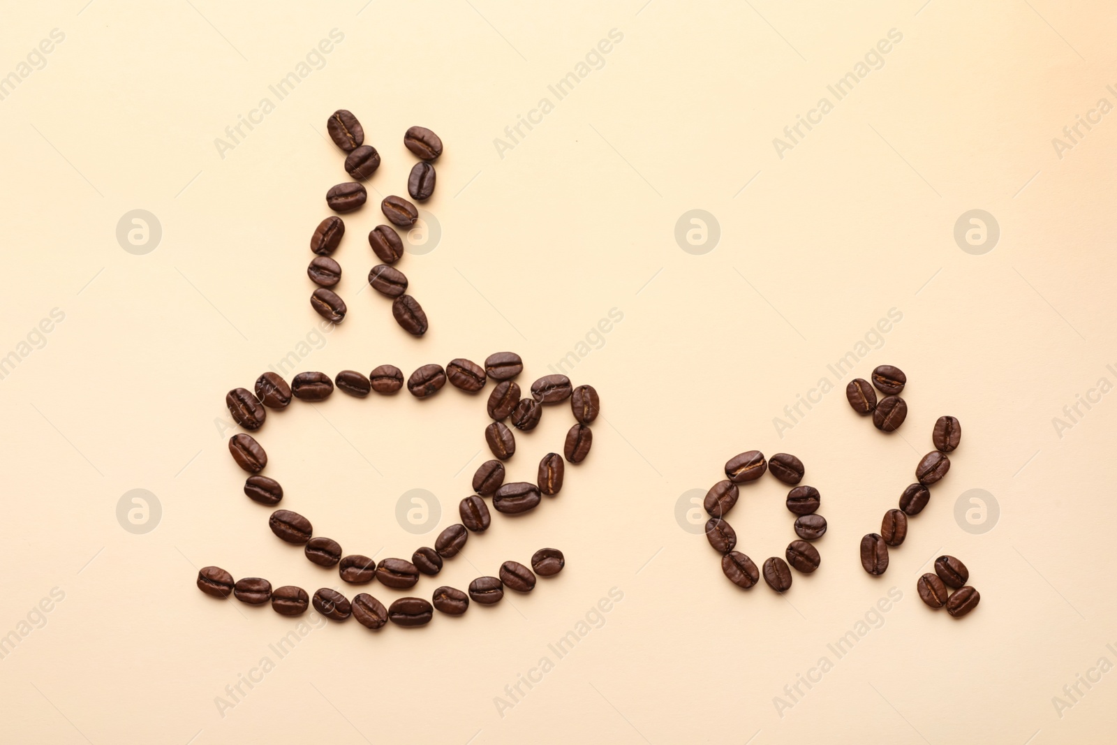 Photo of Cup of coffee and 0 percent made with beans on beige background, flat lay. Decaffeinated drink