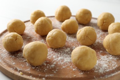 Photo of Shortcrust pastry. Raw dough balls on table, closeup