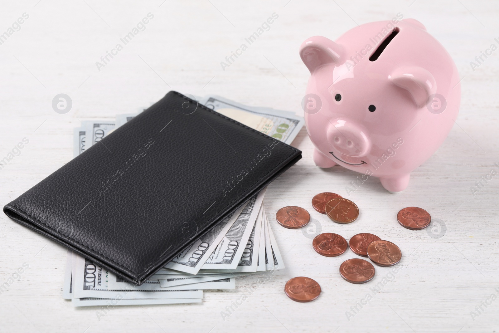 Photo of Pension certificate  with American money and piggybank on white wooden background