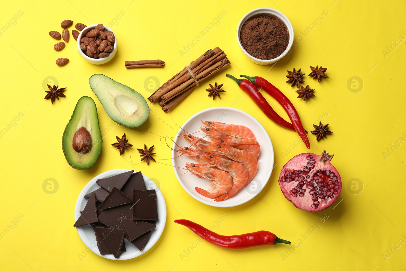 Photo of Natural aphrodisiac. Different products on yellow background, flat lay