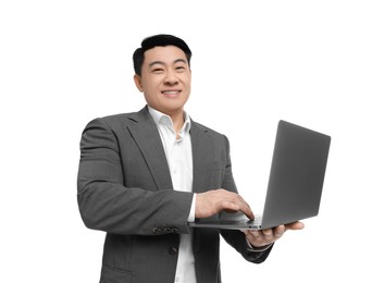 Businessman in suit working on laptop against white background