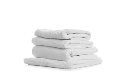 Stack of towels and bedding on white background