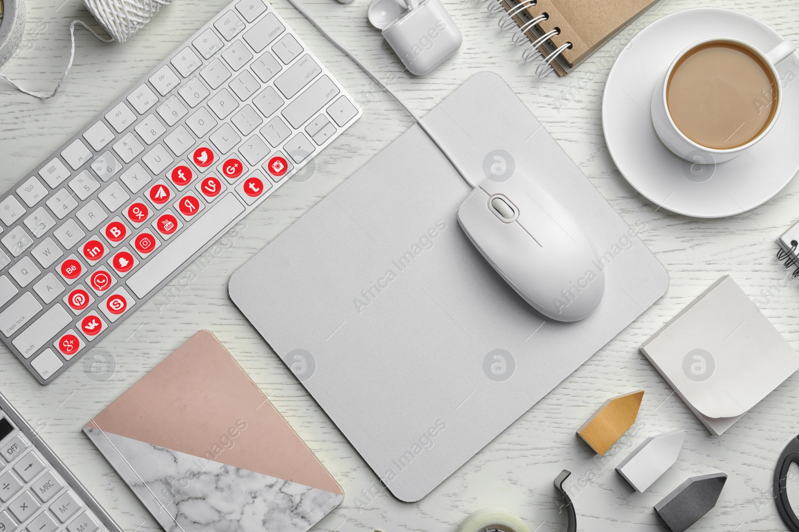 Image of MYKOLAIV, UKRAINE - MAY 4, 2020: Computer keyboard with social media apps logotypes on wooden table, flat lay