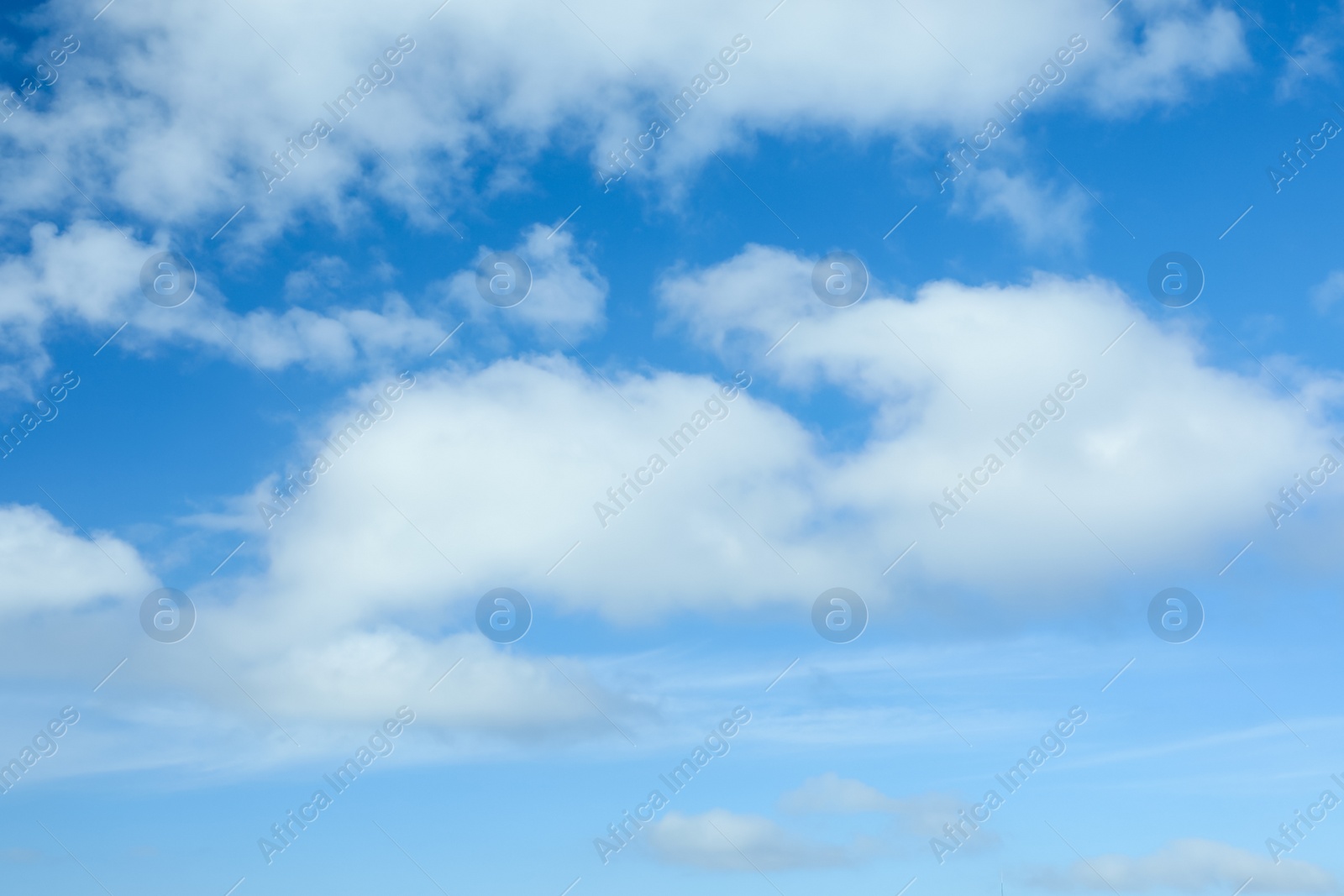 Picturesque view of beautiful blue sky with fluffy white clouds Photo of Picturesque view of beautiful blue sky with fluffy white clouds