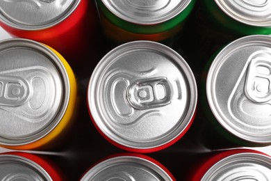 Photo of Energy drinks in cans, top view. Functional beverage