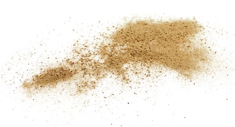 Photo of Pile of brown dust scattered on white background