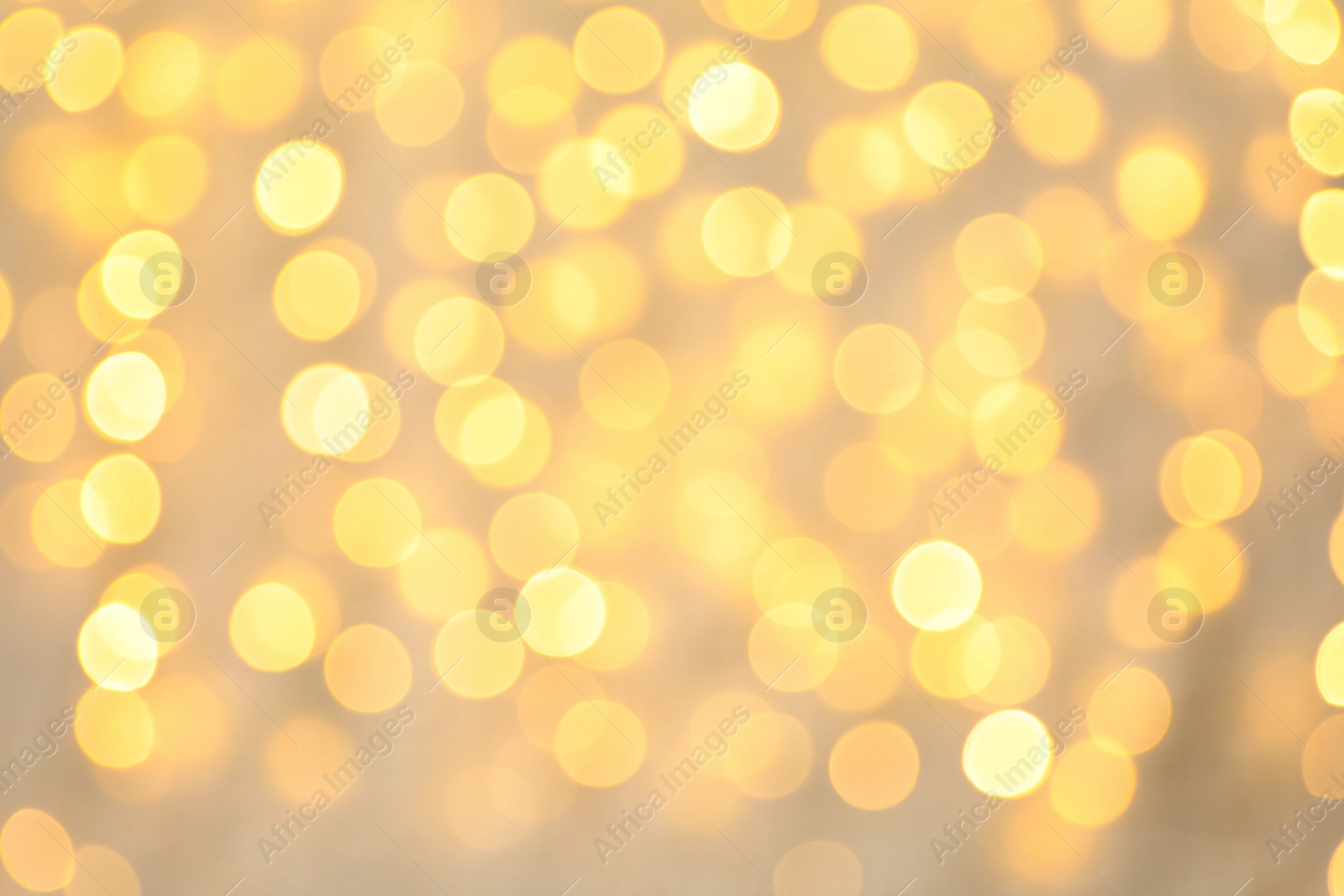 Photo of Blurred view of golden Christmas lights as background. Bokeh effect