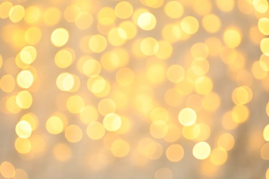 Photo of Blurred view of golden Christmas lights as background. Bokeh effect