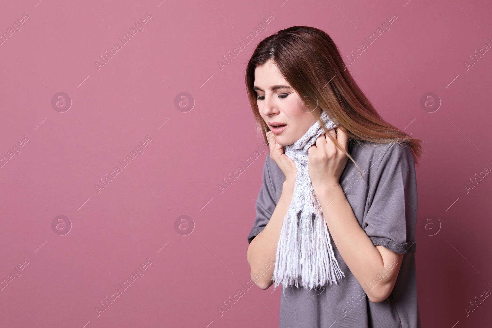 Photo of Woman coughing on color background