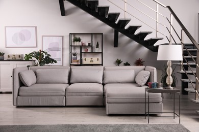 Stylish living room interior with comfortable sofa