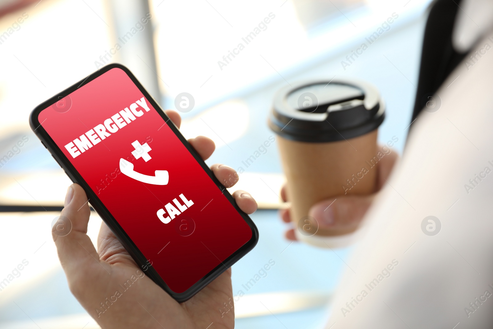 Image of Hotline service. Man making emergency call via smartphone indoors, closeup