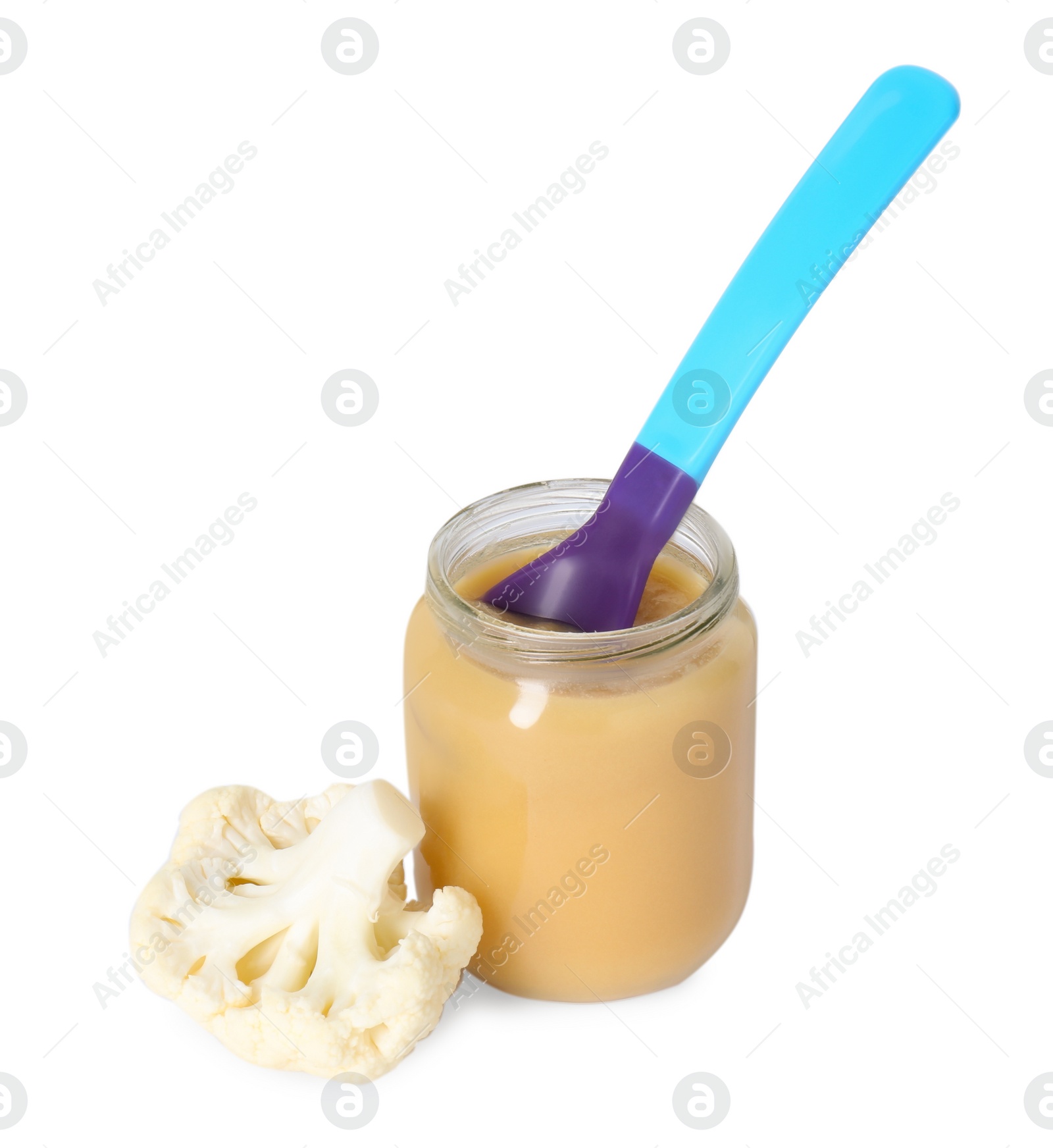Photo of Tasty baby food in jar, spoon and fresh cauliflower isolated on white