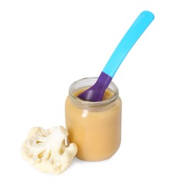 Tasty baby food in jar, spoon and fresh cauliflower isolated on white