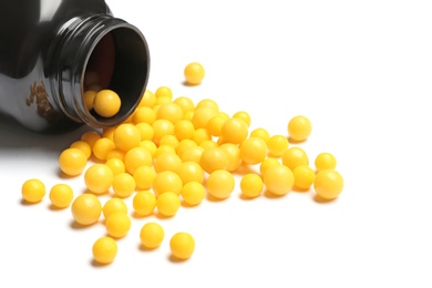 Photo of Bottle with vitamin pills on white background, closeup