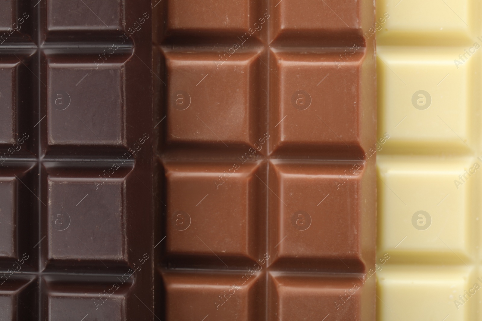 Photo of Different delicious chocolate as background, closeup view