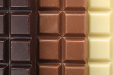 Different delicious chocolate as background, closeup view