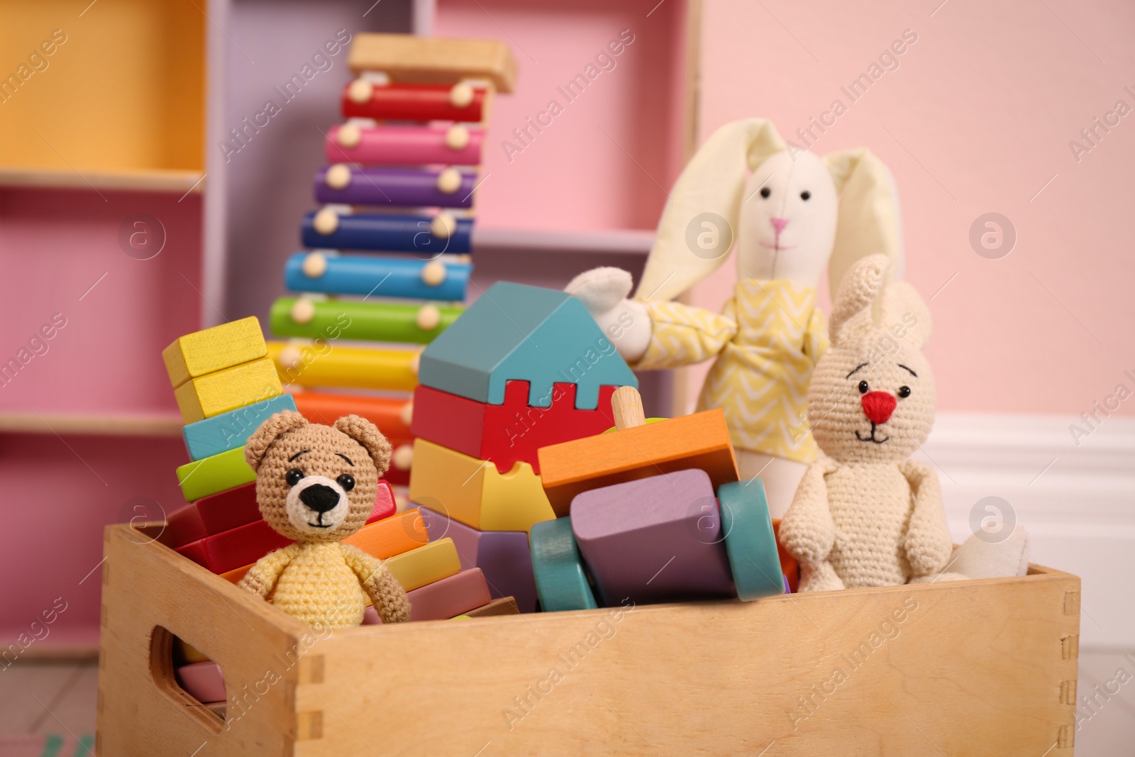 Photo of Set of different cute toys on floor