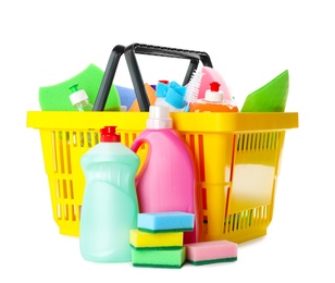 Photo of Yellow shopping basket with different household chemicals on white background