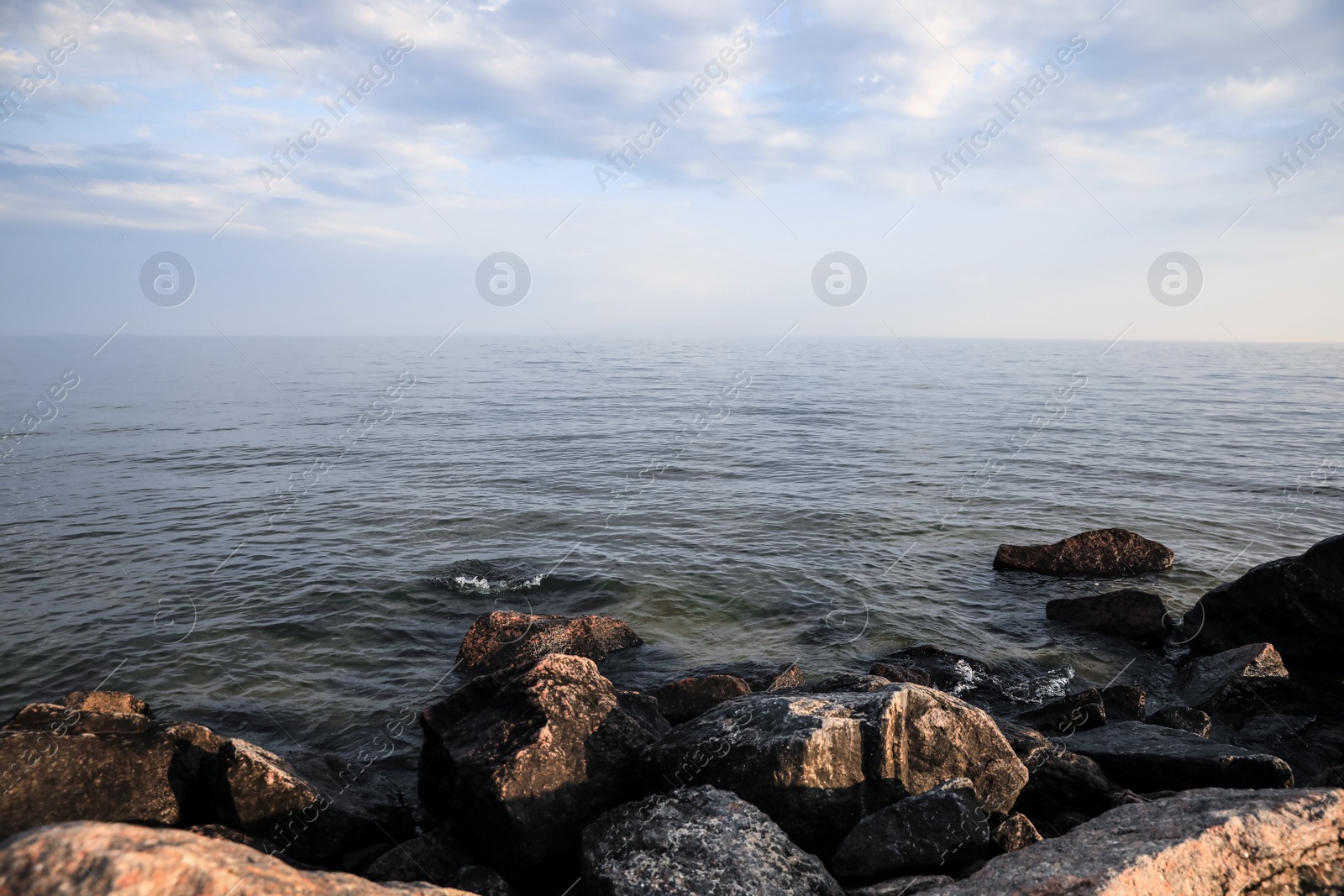 Photo of Beautiful view of rocky beach and calm sea