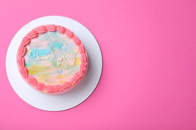 Cute bento cake with tasty cream on pink background, top view. Space for text