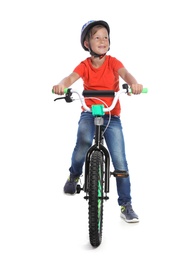 Portrait of cute little boy with bicycle on white background