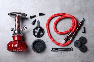 Flat lay composition with parts of hookah on grey table