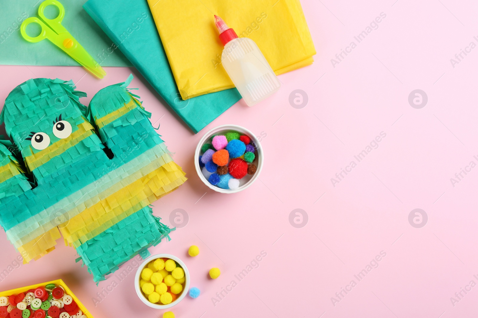 Photo of Flat lay composition with cardboard cactus on pink background, space for text. Pinata diy