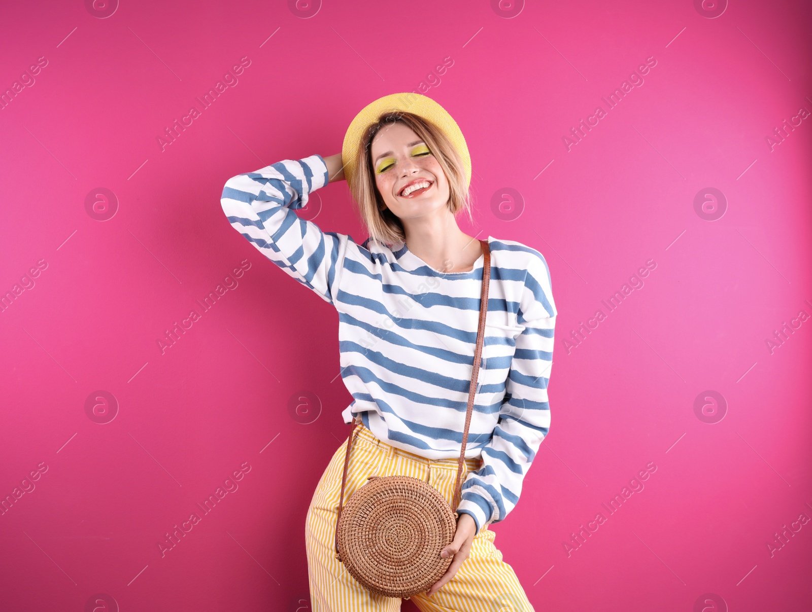 Photo of Beautiful young woman posing on color background. Summer fashion