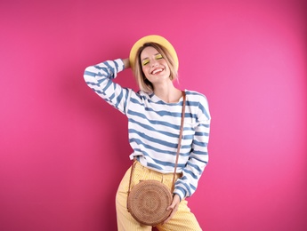 Beautiful young woman posing on color background. Summer fashion