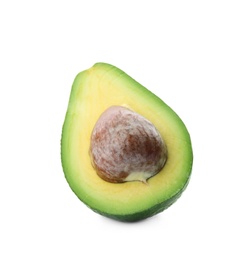 Photo of Half of ripe avocado with pit on white background