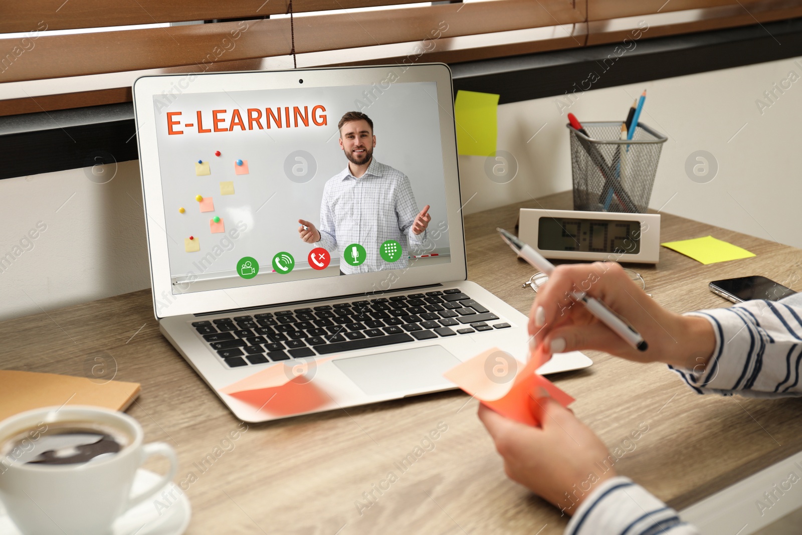 Image of Young woman using laptop for online studying at home, closeup