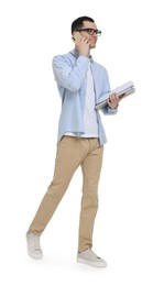 Photo of Young man in glasses holding folders and talking on mobile phone on white background