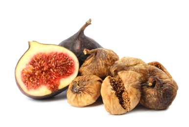 Photo of Delicious dried and fresh figs on white background. Organic snack